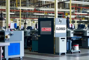 Closed sign on a manufacturing facility door