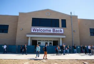 A view of South Park High School with students outside after reopening following a water main break.
